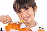 Smiling Young Boy With Spoon Of Flakes, Closeup Stock Photo