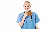 Smiling Young Female Surgeon Stock Photo