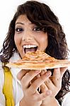 Smiling Young Lady Eating Pizza Stock Photo