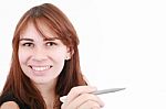 Smiling Young Lady With Pen Stock Photo