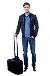 Smiling Young Man Going To Travel Stock Photo