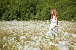 smiling young Woman In Meadow Stock Photo