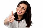 Smiling Young Woman Showing Thumbs Up Stock Photo