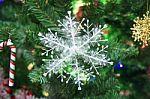 Snowflake Decorated On Christmas Tree Stock Photo