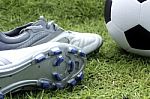 Soccer Shoes And Soccer Ball Stock Photo