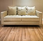 Sofa And Wooden Floor Stock Photo