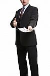 Some Unrecognizable Businessman In Suit Showing A Spread Of Poun Stock Photo