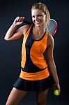 Sporty Teen Girl Tennis Player With Racket. Isolated On Black Stock Photo