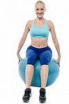 Sporty Woman Exercising With Blue Ball Stock Photo