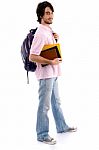 Standing Boy Holding Books And Bag Stock Photo