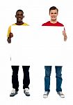 Standing Guys Holding Blank Board Stock Photo