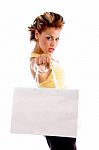 Standing Woman Showing Shopping Bag Stock Photo