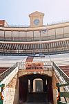 Stands With An Emergency Exit And The Ancient Clock Of A Spanish Arena Stock Photo