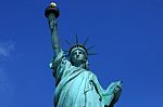 Statue Of Liberty On Clear Blue Sky Stock Photo