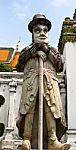 Statue Of Man At Wat Pho In Bangkok, Thailand Stock Photo