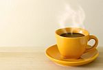 Steaming Coffee Cup On Table Stock Photo
