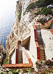 Steep Staircase Built On A Mountain Overlooking The Sea Stock Photo