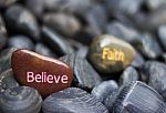Stone Engraved With Believe Faith Stock Photo