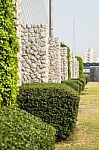 Stone Wall In The Garden For Background Stock Photo
