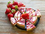 Strawberry Swirled Cheesecake On A Rustic Background Stock Photo