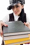 Student In Cap Holding Stack Of Books Stock Photo
