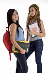 Students Holding Bag And Books Stock Photo
