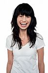 Studio Shot Of Beautiful Smiling Woman Stock Photo