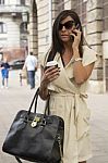 Stylish Young Business Woman Speaking On Phone, Street Backgroun Stock Photo