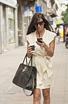 Stylish Young Business Woman Texting On Street Stock Photo