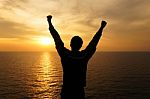 Successful Silhouette Man At Sunset Stock Photo