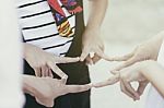 Successful Team Of Children Forming A Star With Their Fingers Touching To The Form The Points Stock Photo