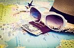 Sunglasses, Passport, Money, Hat And Aircraft On The World Map Stock Photo