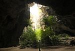 Sunlight Through A Cave Hole In Thailand Stock Photo