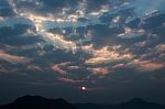 Sunrise Rays On Morning Blue Orange Sky Cloud With Mountain Stock Photo