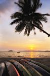 Sunrise With Kayak Boat And Coconut Palm Trees On Tropical Beach Stock Photo