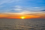 Sunset At Sea With Beautiful Clouds In The Evening And Twilight Stock Photo