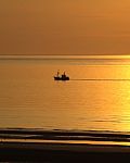 Sunset With Fisherboat Stock Photo
