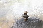 Superimposed Waterfall Pebble Rock Arranged On Big Stone Stock Photo