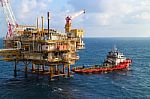  Supply Boat Transfer Cargo To Oil And Gas Industry And Moving Cargo From The Boat To The Platform Stock Photo