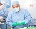 Surgeon Preparing The Tools For Surgery Stock Photo