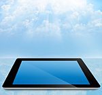 Tablet Pc With Cloudy Sky Stock Photo