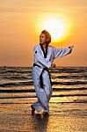 Taekwondo Man Training On Beach Stock Photo