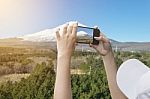 Taking A Picture Of Mount Fuji With A Smart Phone Stock Photo