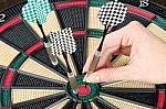 Taking Out Dart From Dartboard Stock Photo