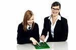 Teacher And Student Working On Calculator Stock Photo