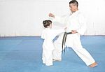 Teacher Training Karate To A Little Girl Stock Photo