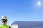 Technician And Solar Panels Stock Photo