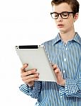 teenage Boy Using Touchpad Device Stock Photo