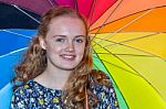 Teenage Girl Holding Colorful Umbrella Stock Photo