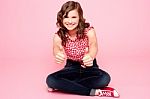 Teenage Girl Showing Thumbs Up Stock Photo